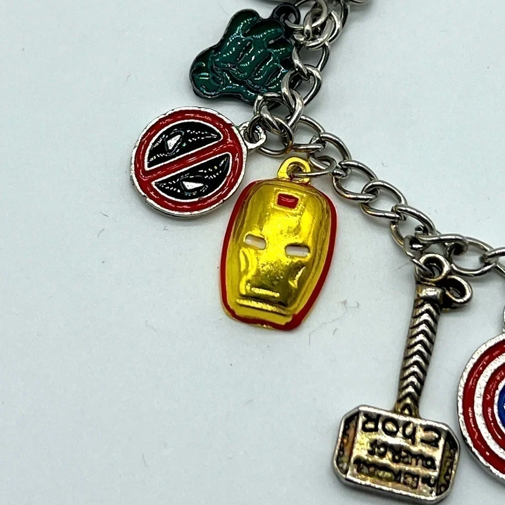 AVENGERS character charm bracelet featuring Thor’s hammer and other symbols